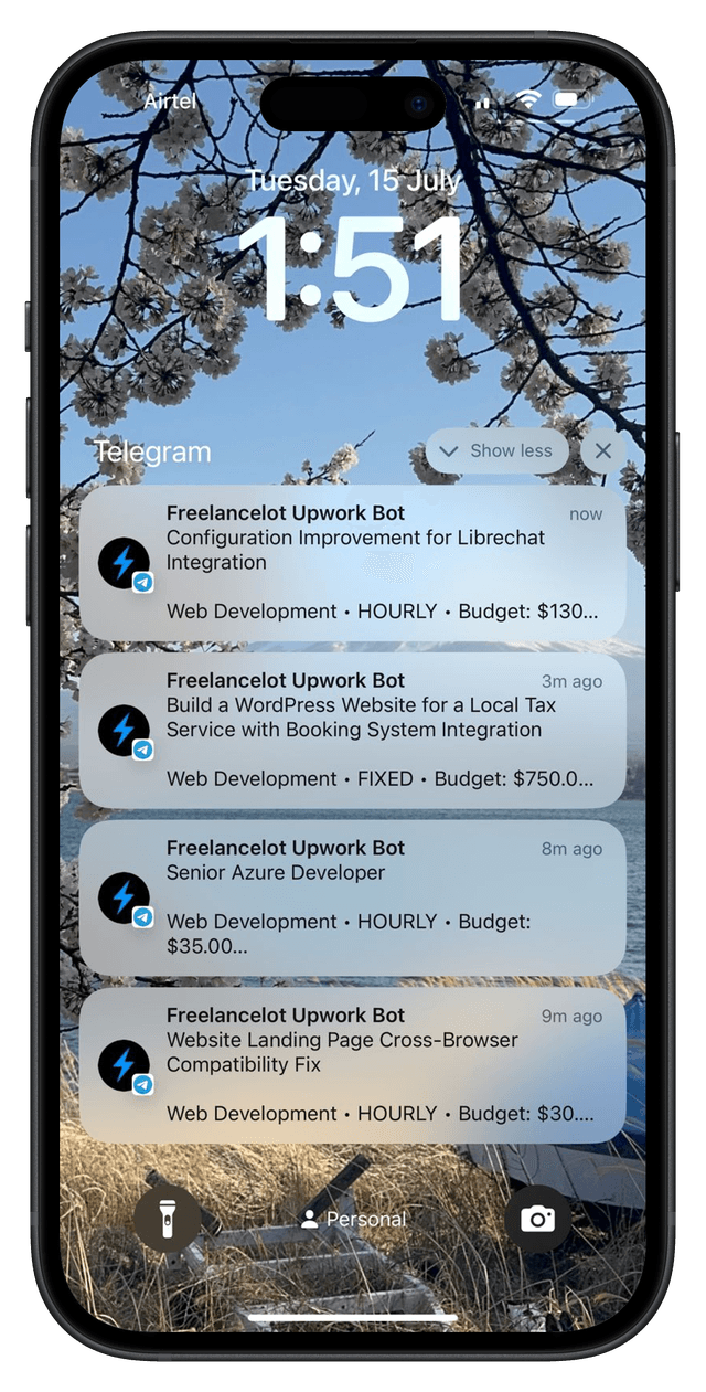 Phone showing Freelancelot Telegram alerts